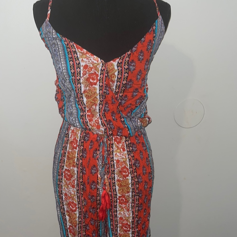 This is a multi color romper in the size medium.